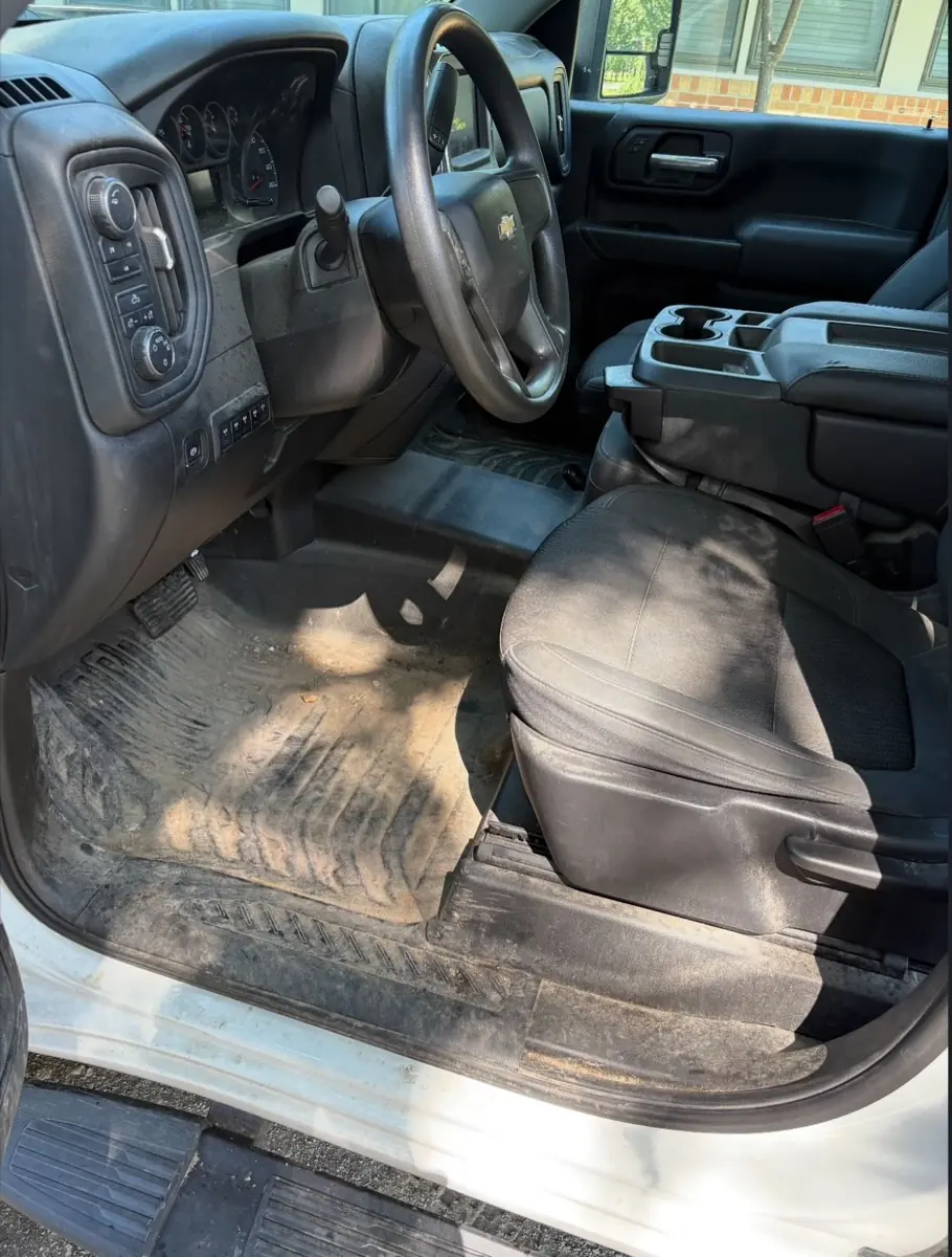 Chevy Silverado interior before an interior reset, heavy construction dirt, Johnson County KS
