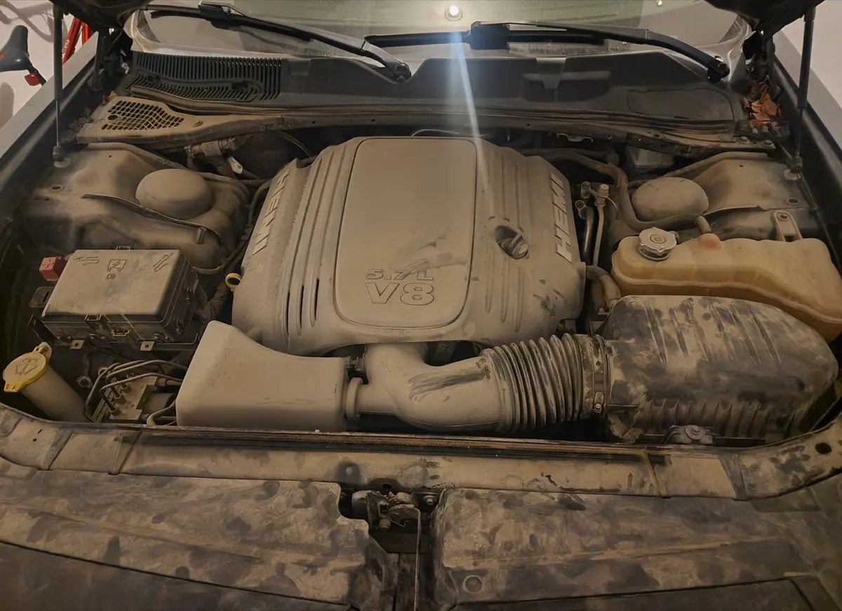 Dodge HEMI 5.7L V8 engine bay before detailing, heavy dust and road grime, Johnson County KS